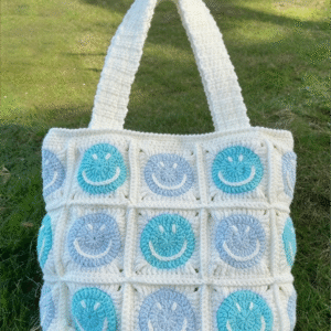 five strands of cotton yarn are knitted together. a blue smiling face corn patterned diagonal crossbody bag, a daily schoolbag, a single shoulder bag, a snack and meal box bag. unique, suitable for giving as a gift or for personal use. suitable for daily commuting. suitable for pairing with any clothes to add your distinctive beauty. children can put stationery and travel snacks in it. soft and not prone to color fading.