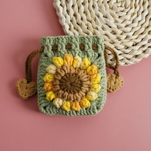 green hand knitted sunflower drawstring pouch; unique design; soft cotton lipstick & earphone bag; mini portable purse; daily use; ideal gift for her & kids; lightweight & durable; holds lipstick, earbuds, coins and keys