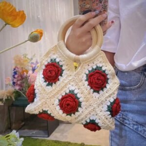 rose woven handbag, with a wooden handle. made of five strands of cotton yarn by hand knitting. it is a daily schoolbag, a shoulder bag, a snack and meal box bag. unique and perfect for giving as a gift or for personal use. suitable for daily commuting. it is suitable to be paired with any clothes to add your distinctive beauty. children can use it to store stationery and travel snacks. soft and not prone to color fading.
