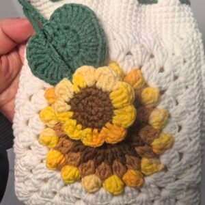 white hand knitted sunflower crossbody bag, soft cotton crochet shoulder purse；drawstring phone pouch with adjustable strap for daily commute；durable, lightweight, cute floral design for women and girls；ideal gift for birthday, mother's day, casual outings and travel