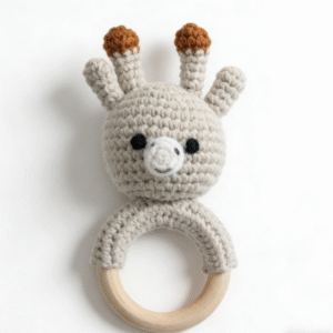 adorable handmade crochet giraffe teething ring, easy for babies to grasp; crocheted with soft cotton, ideal for little ones to snuggle and explore. featuring a sweet giraffe design with delicate details, this amigurumi style teething ring adds a charming touch to any nursery. a lovely choice as a baby shower present, newborn gift, or cozy playmate for your little one’s daily moments.