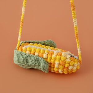 corn pen bag, with a zipper, versatile fruit themed eco friendly bag, made of cotton yarn knitting in golden color, knitted with wool yarn, unique, suitable for gift giving or personal use. children can put their stationery in it, adults can put their lipsticks and cosmetics in it, and it can also be used as a portable wallet.