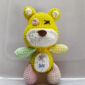 round belly fluffy paws hand knitted yellow tibbers bear keychain; vivid 3d teddy bear design; soft cotton crochet hanging charm; lovely cartoon style; lightweight & easy to carry; perfect for keys, bags & backpacks; a sweet daily companion for bear lovers & game fans of all ages