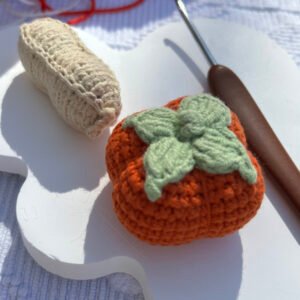 hand knitted peanut & persimmon keychain, soft cotton yarn, unique lucky charm, safe & cozy decor, meaningful good fortune keepsake